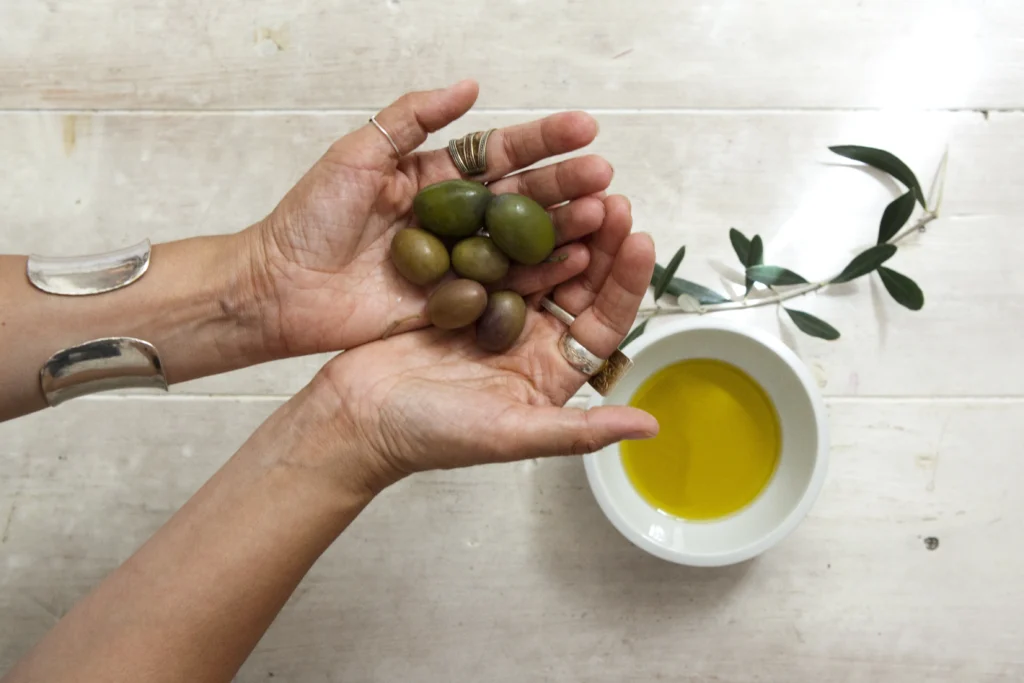 A hand holding olive